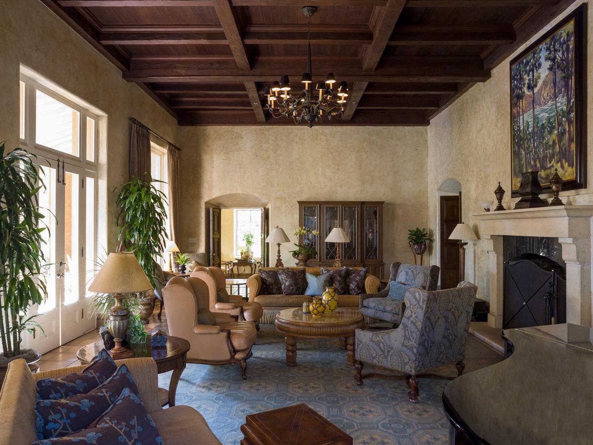 Lounging area with many different seating options at the resort featuring a fire place