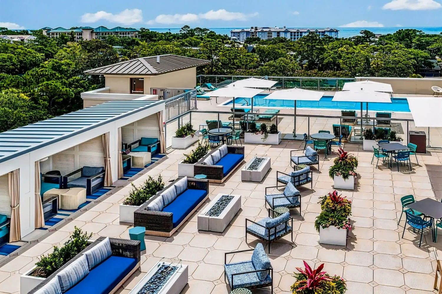 Outdoor seating, cabanas and swimming pool at the Courtyard Hilton Head Island