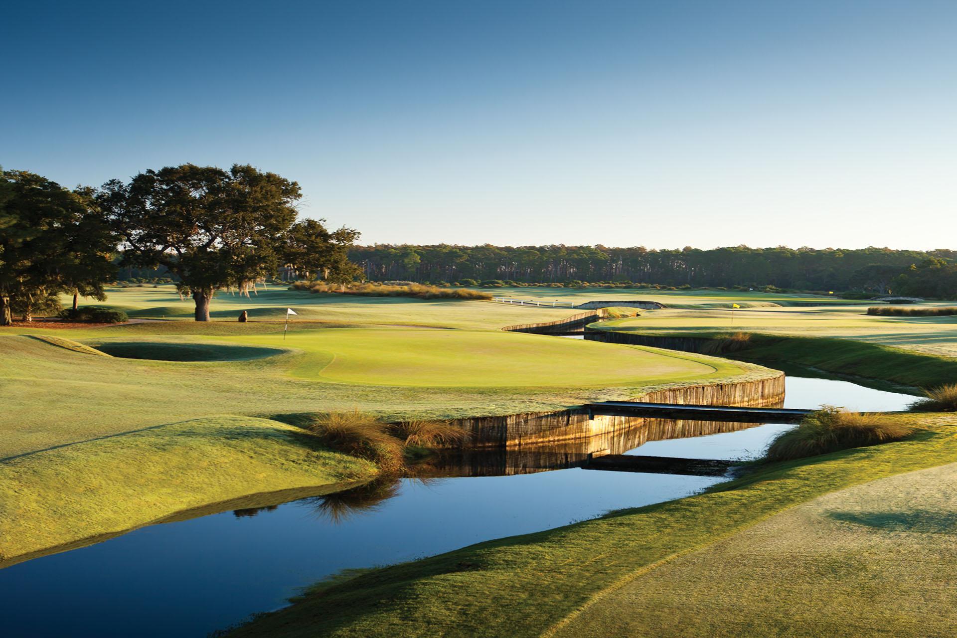 A series of greens and fairways wind through wooden bridges and tranquil water features.