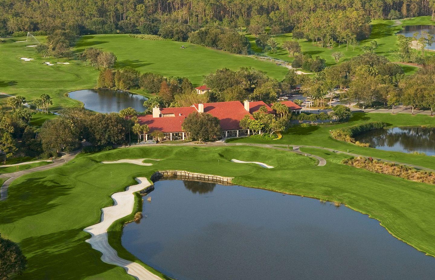 Aerial view of the clubhouse sandwiched between two half's of the Grand Cypress course