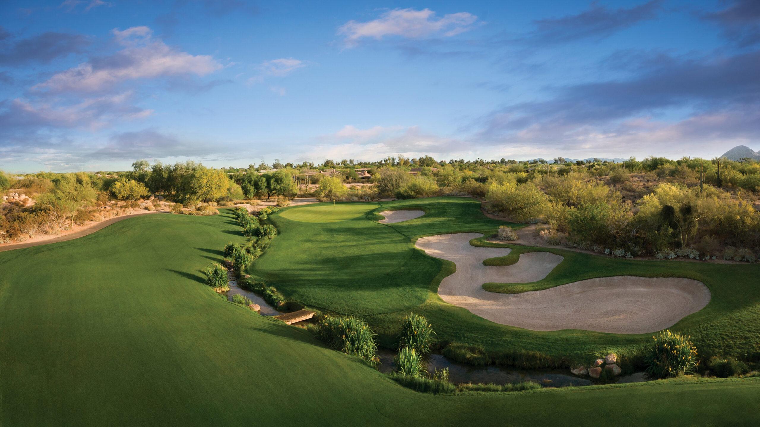 Birds eye view of the Grayhawk Golf Course with a large uniquely shaped sand bunker on the green
