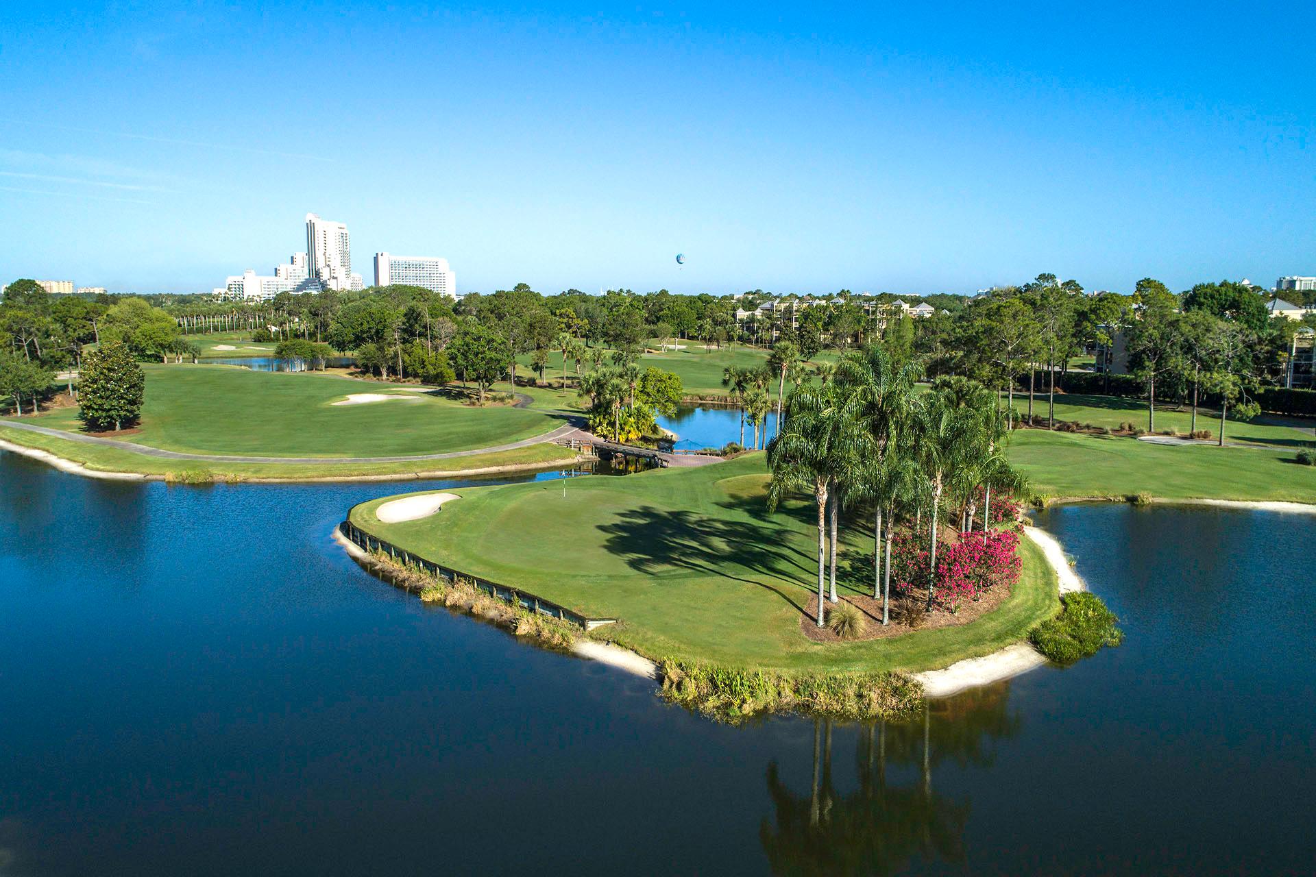 Panoramic view of the Hawk's Landing golf course with an island like structure surrounded by water