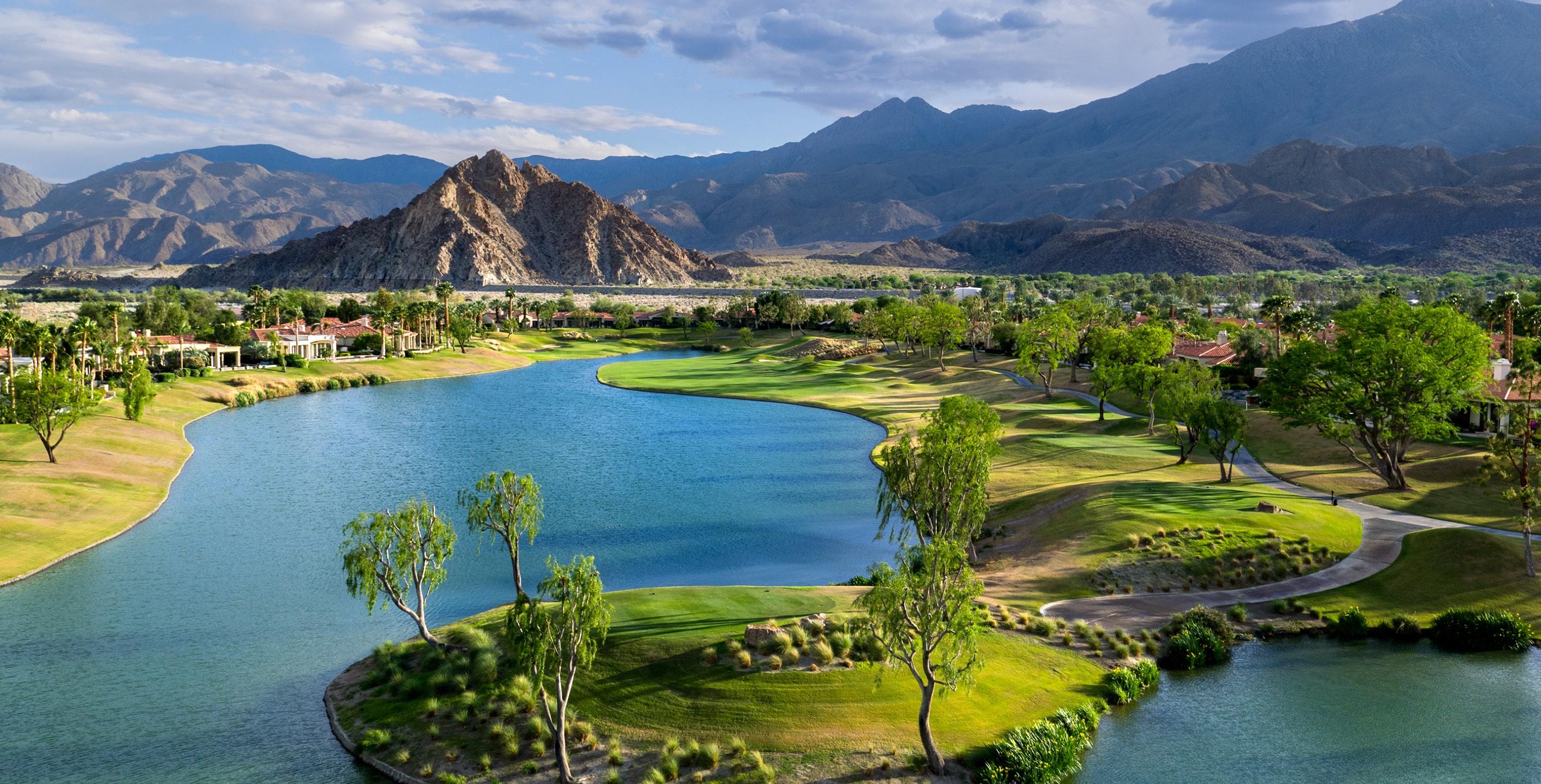 Aerial view of the resorts grounds showing a large water hazard that runs through the golf course
