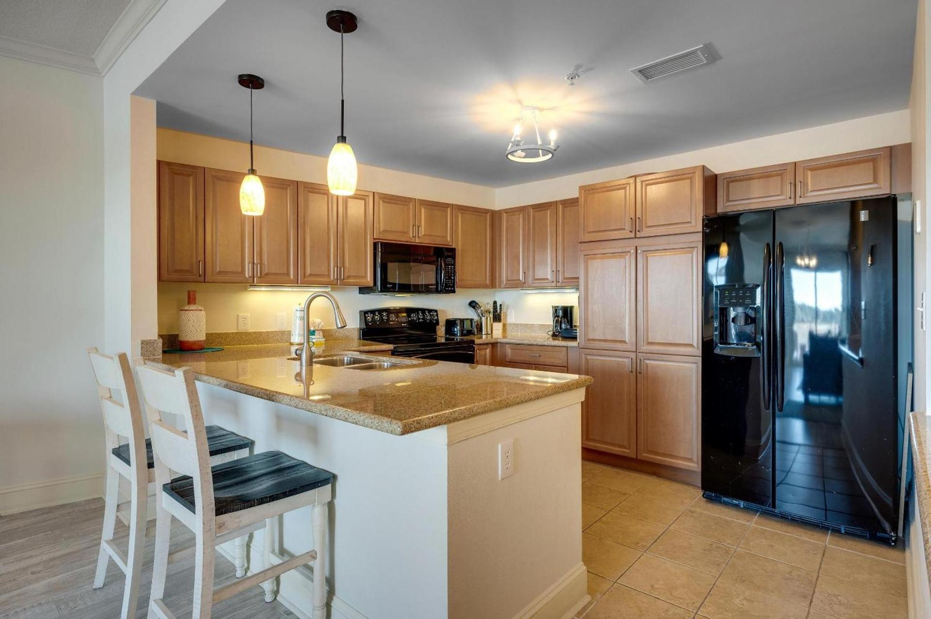 Fully equipped modern kitchen as part of a suite at the hotel