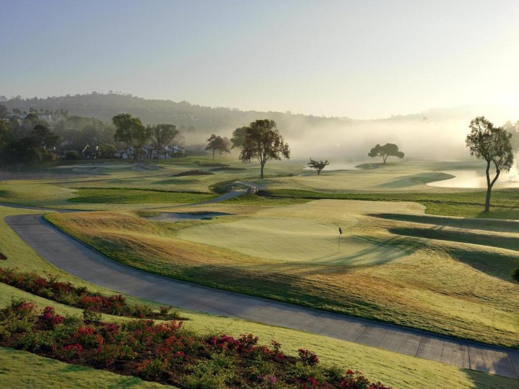 Fog narrowing your view of the Omni La Costa Resort course with a well maintained green still showing