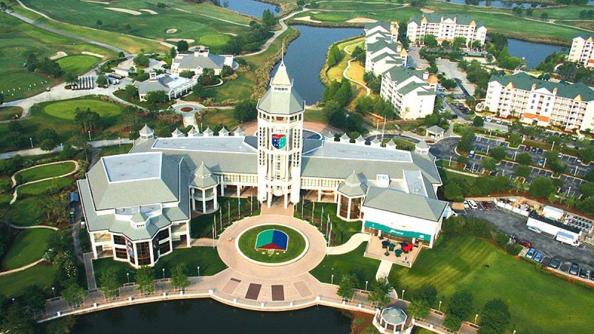 Aerial shot of the resort building with there logo chiselled into the resort and also on the front garden grass