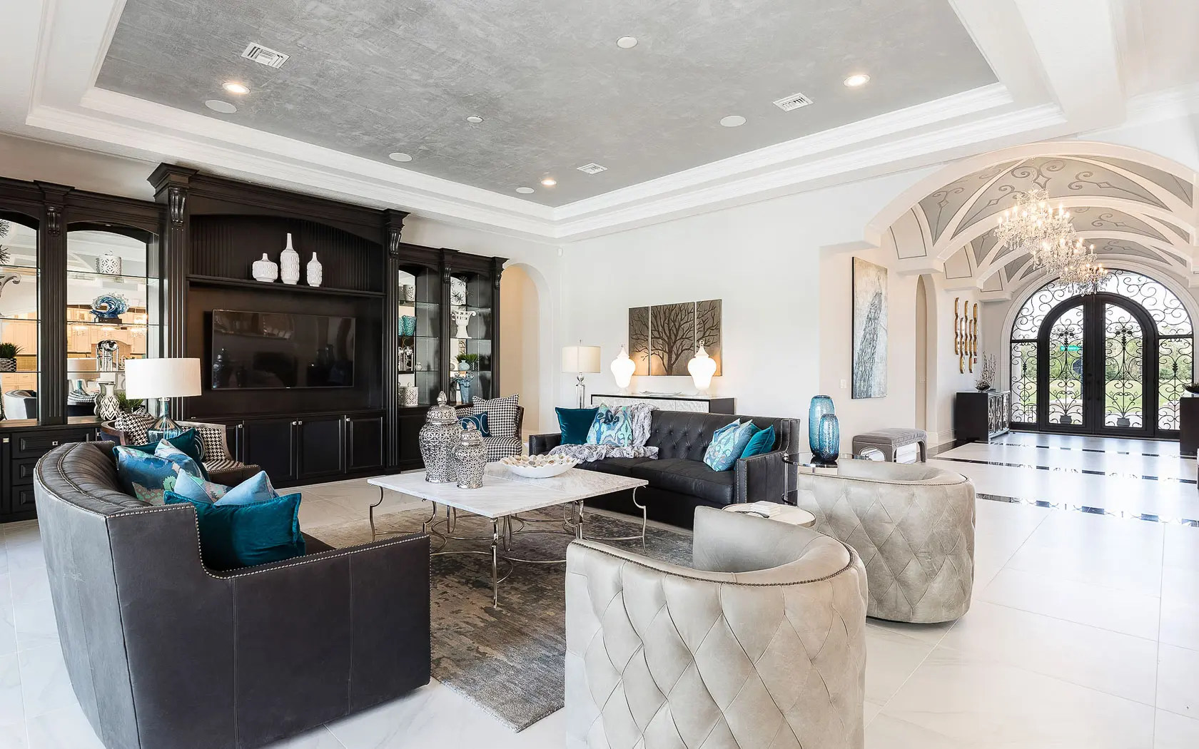 A grand front entrance with chandlers leading to the living room at the Reunion Resort