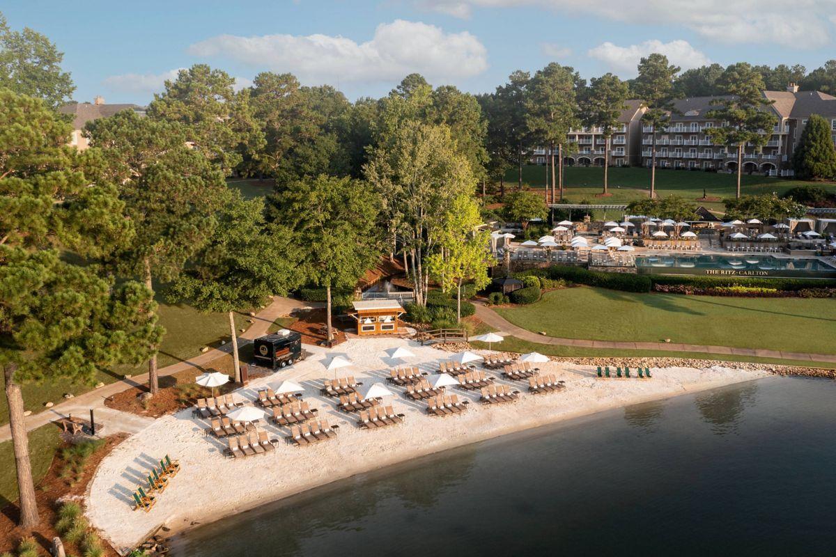 Overhead shot of the hotel highlighting its beach sunbeds and also swimming pool