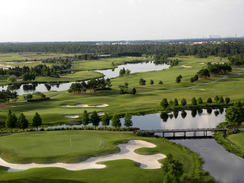 Scenic golf course layout with interconnecting lakes and rolling fairways.