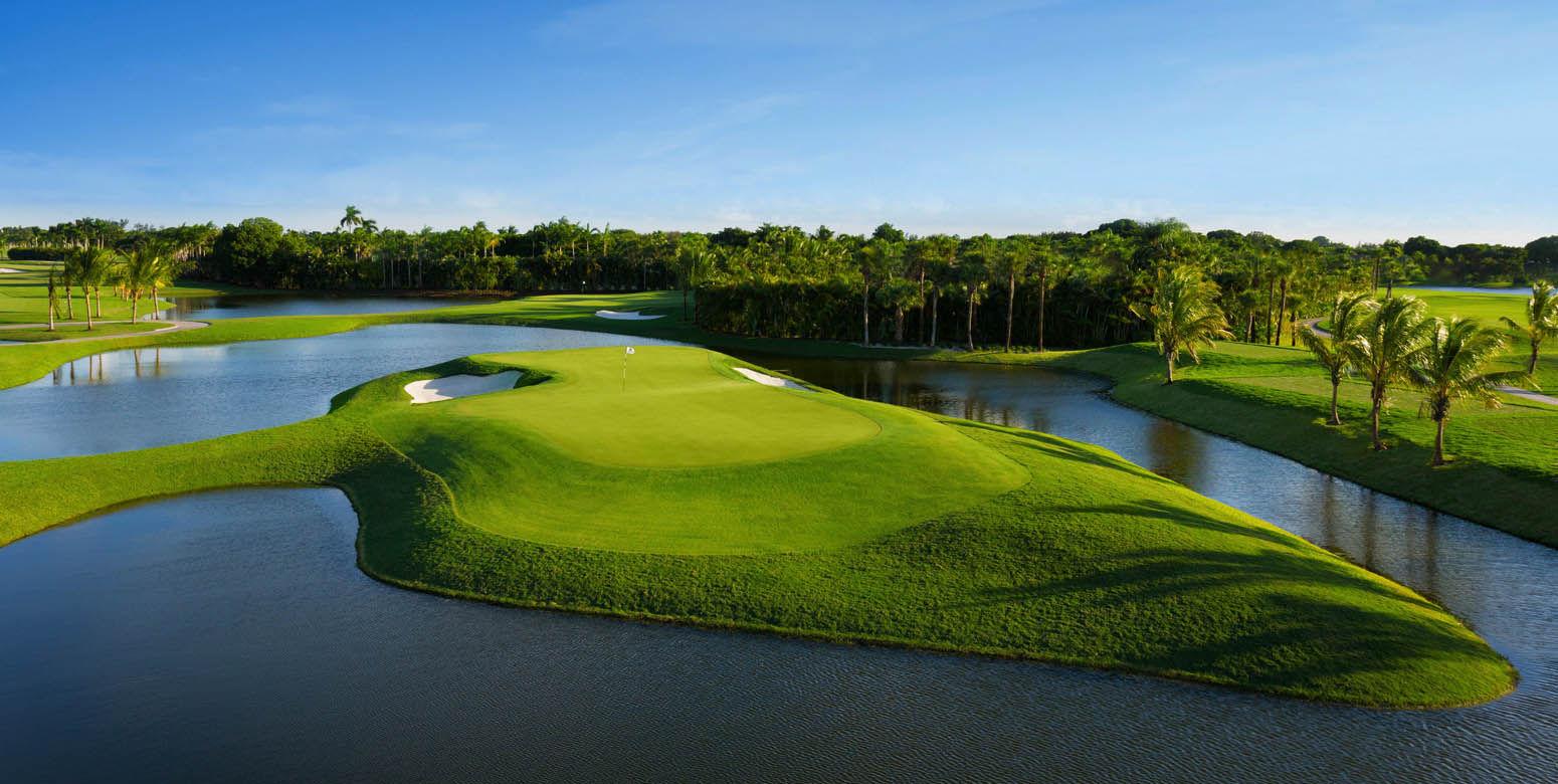 An island manicured green surrounded by water at the Silver Fox Course