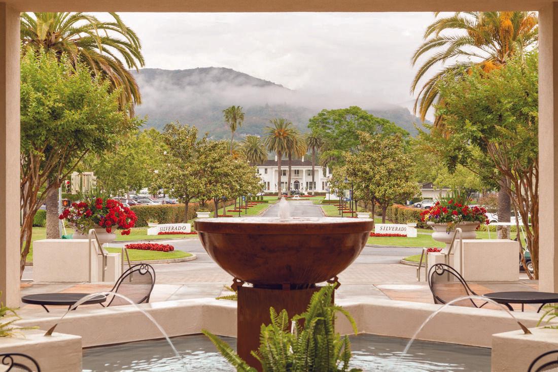 A water fountain at the resort with a driveway