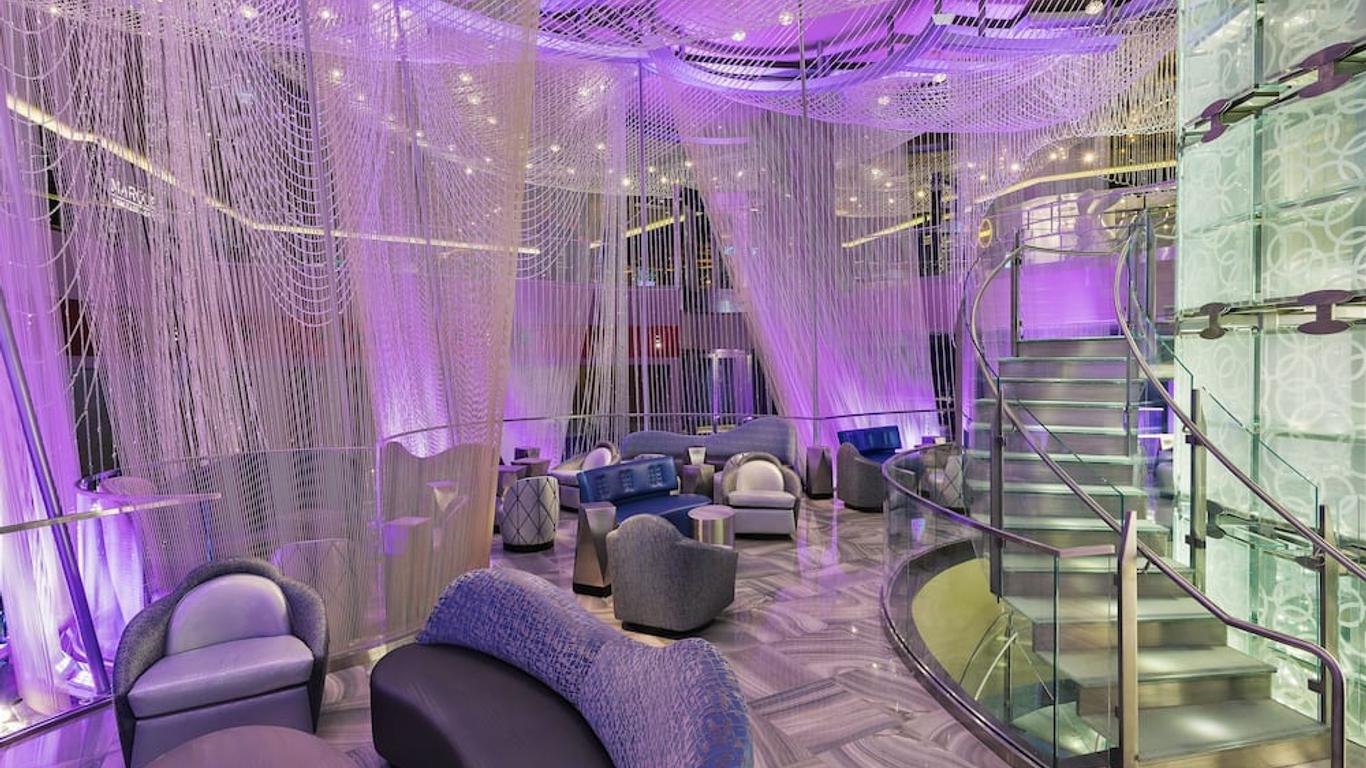 A lounging area in the hotel with a purple design