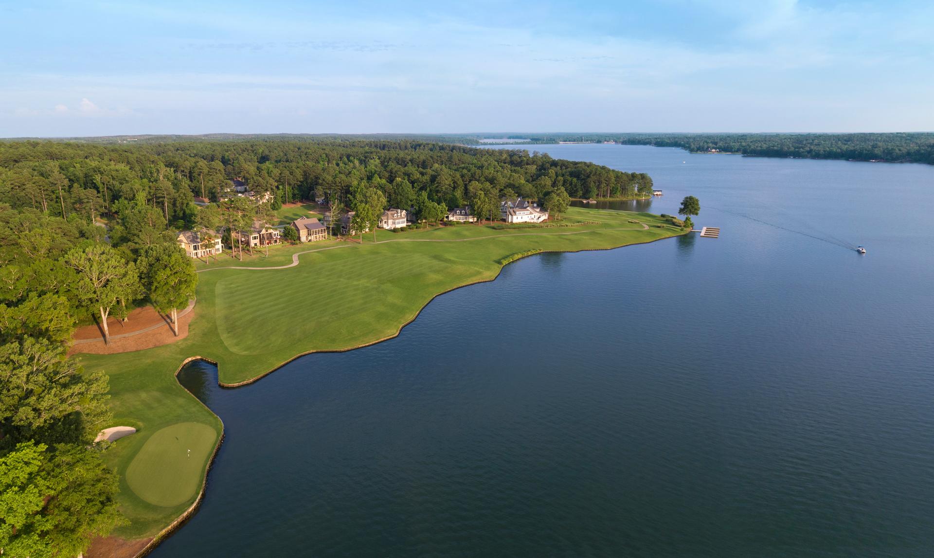 Birdseye view of local houses over looking a wide fairway with sea views