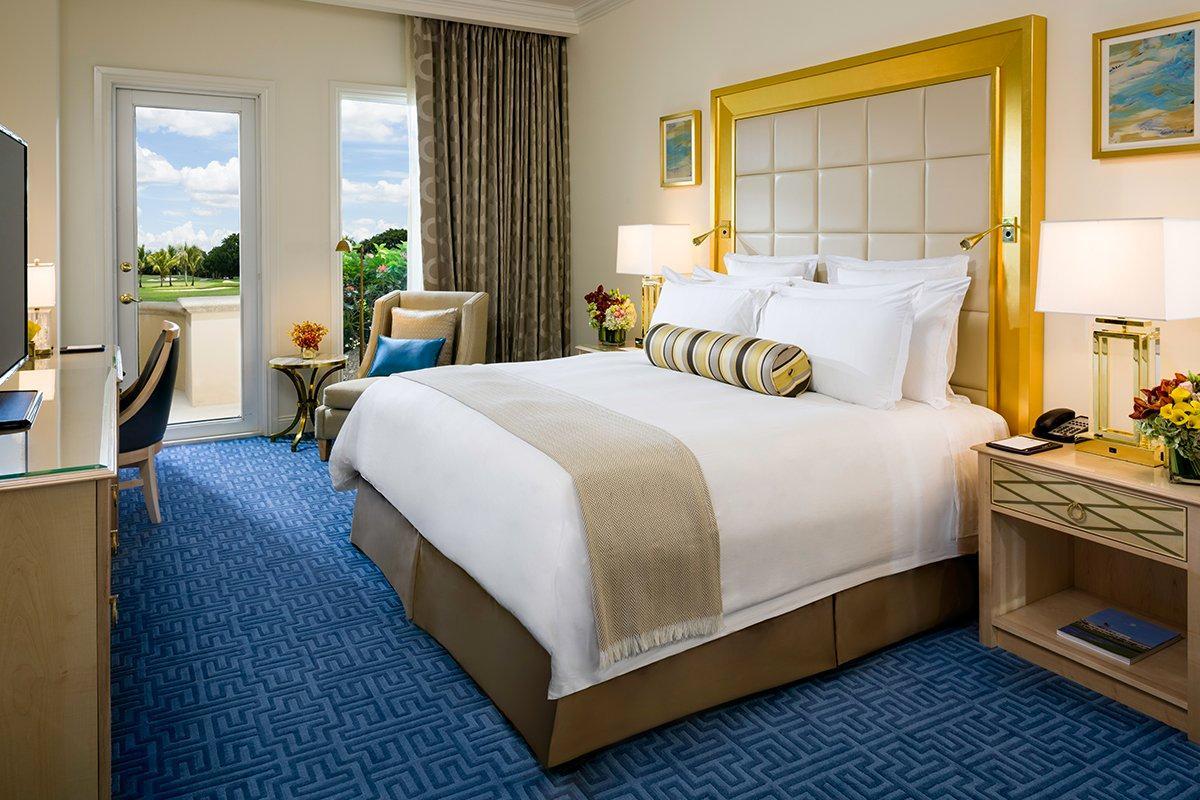Grand doubled bed room at the Trump National Doral Miami with balcony views of the course