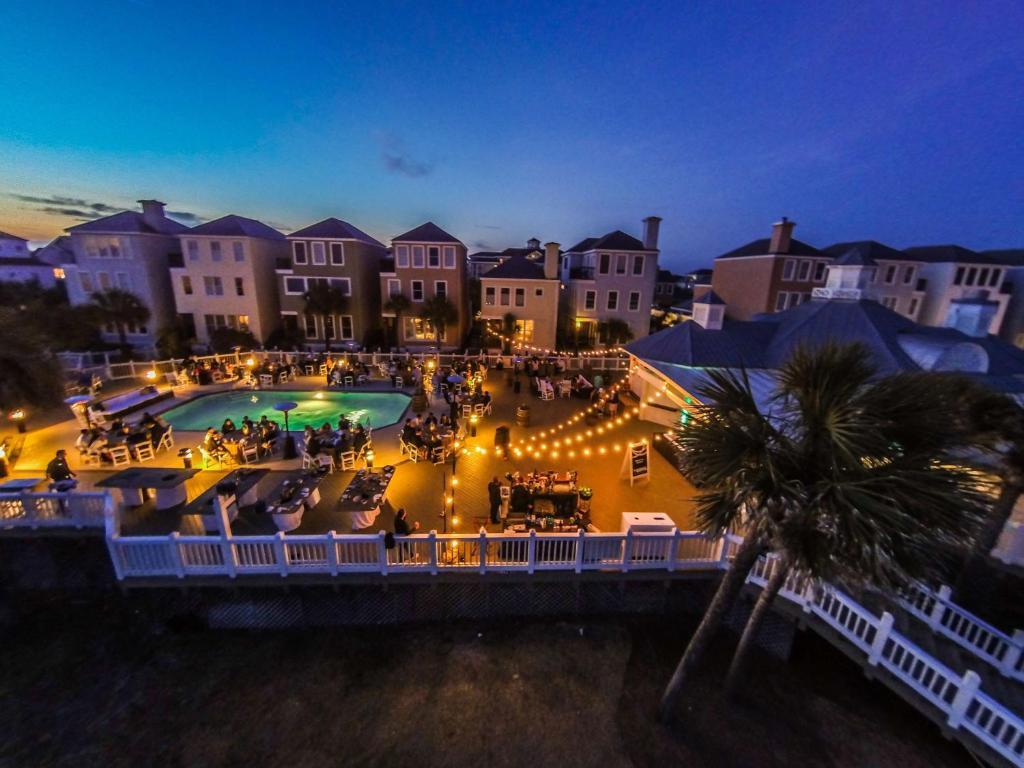 Guests enjoying their evening at the pool side restaurant as part of the Wild Dunes Resort
