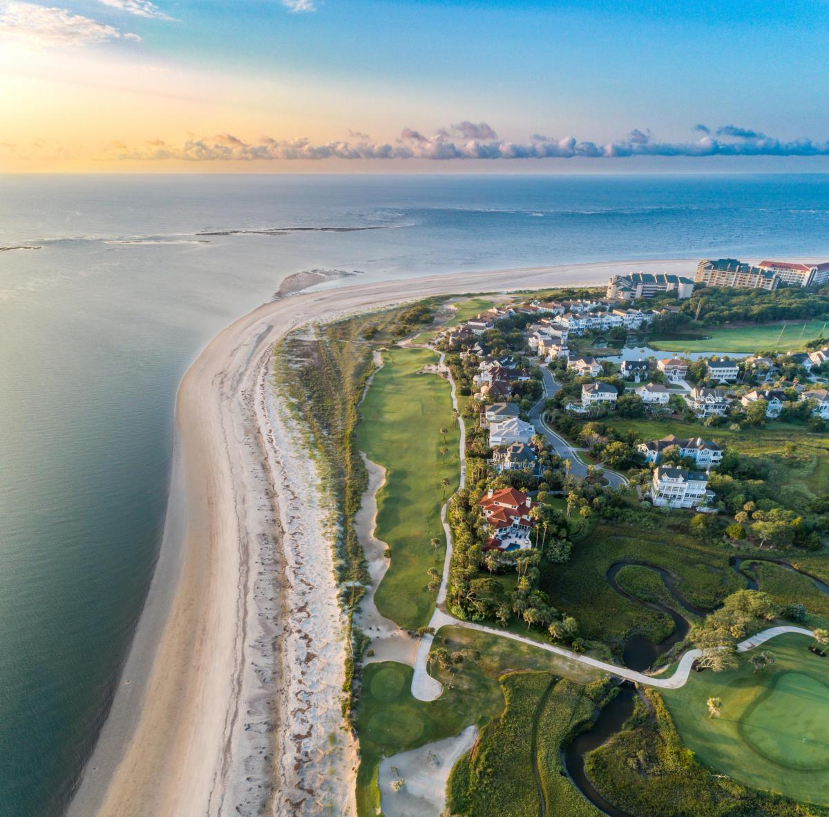 Aerial view of the sun setting over the coastal views you can enjoy from the resort