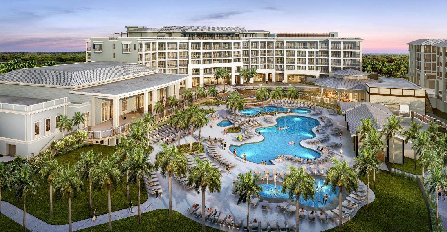 Wild Dunes Resort building towering over the swimming pools