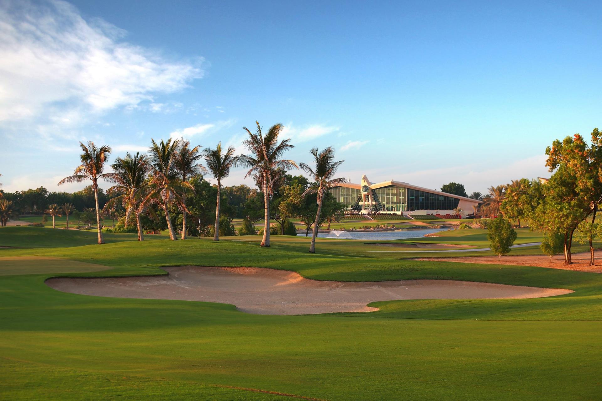 The Abu Dhabi Golf Club course nestled with palm trees and sand bunkers