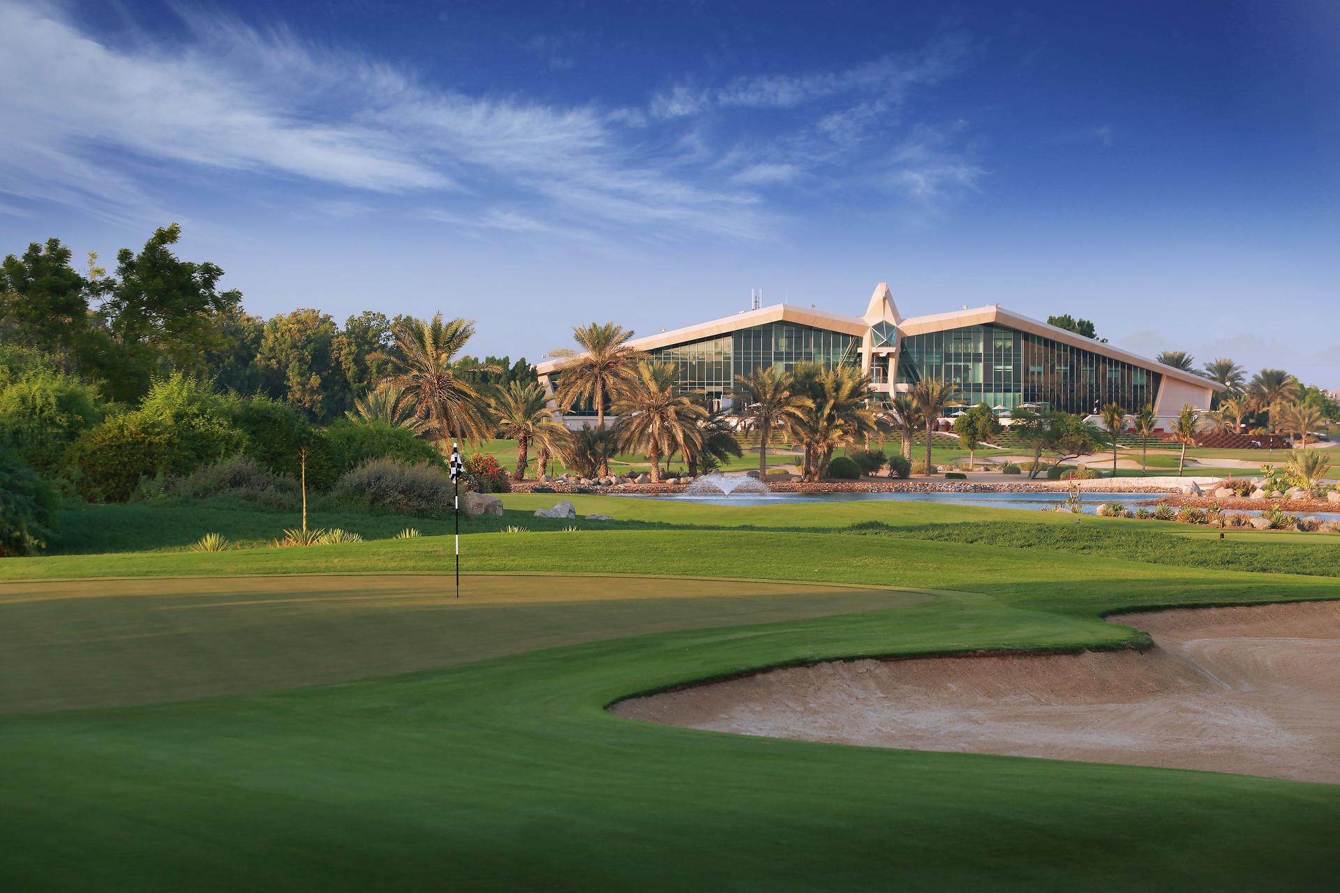 The Abu Dhabi Golf Clubhouse overlooking the course littered with palm trees
