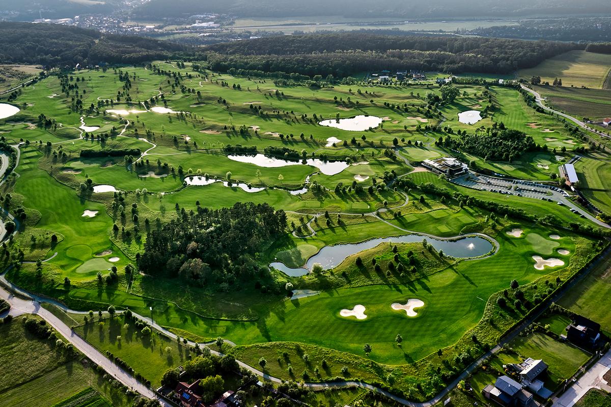 Aerial view of the Albatross Golf Resort littered with water hazards and sand bunkers