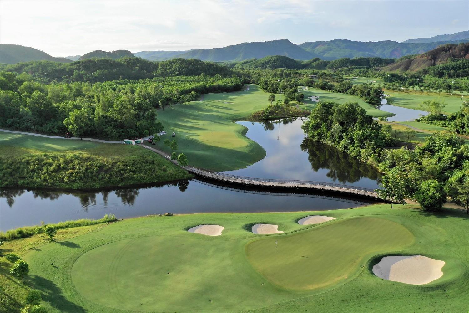 Aerial view of the Ba Na Hills Golf Club with a bridge to navigate the water hazard