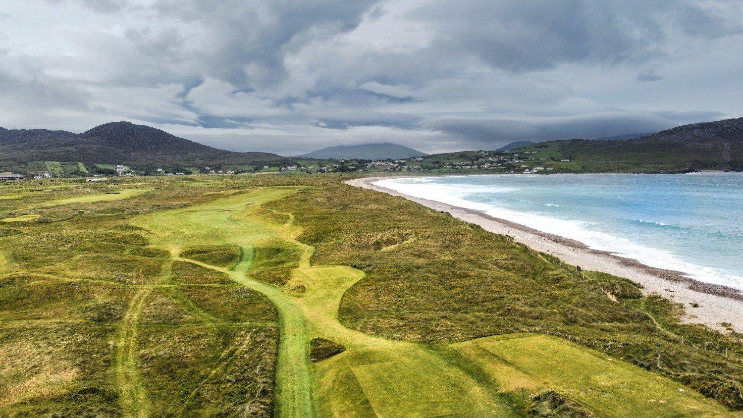 Wide angle view of the firm fairways which neighbour with the coast line beach and sea