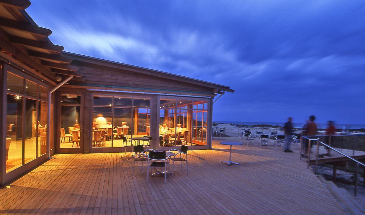 Outdoor and indoor lounging area at the Barnbougle Resort