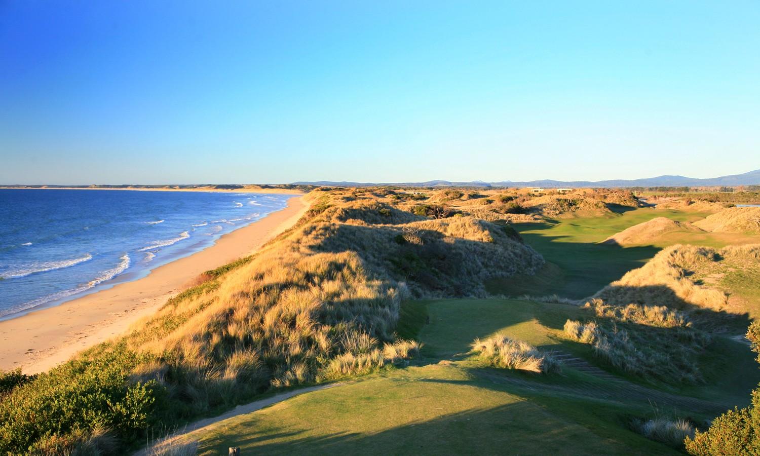 A winding fairway surrounded by a hilly rough on the Barnbougle Resort golf course