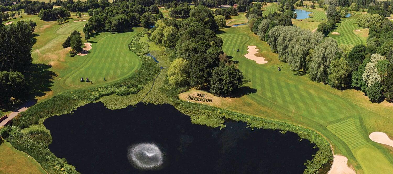 Birds eye view of The Brabazon course at The Belfry showing its branded greenery a large pond and well-maintained fairways