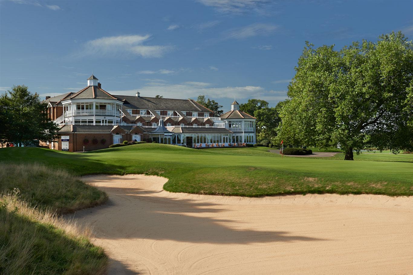 The Belfry clubhouse looking over a strategically placed green with a large sand bunker