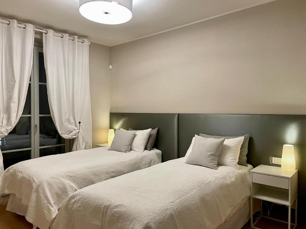 Twin bed room at Bogogno Golf Resort