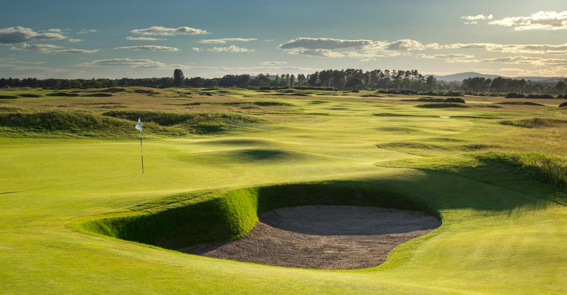 Deep sand bunker at the course placed strategically next to the flagstick on the green at the championship course
