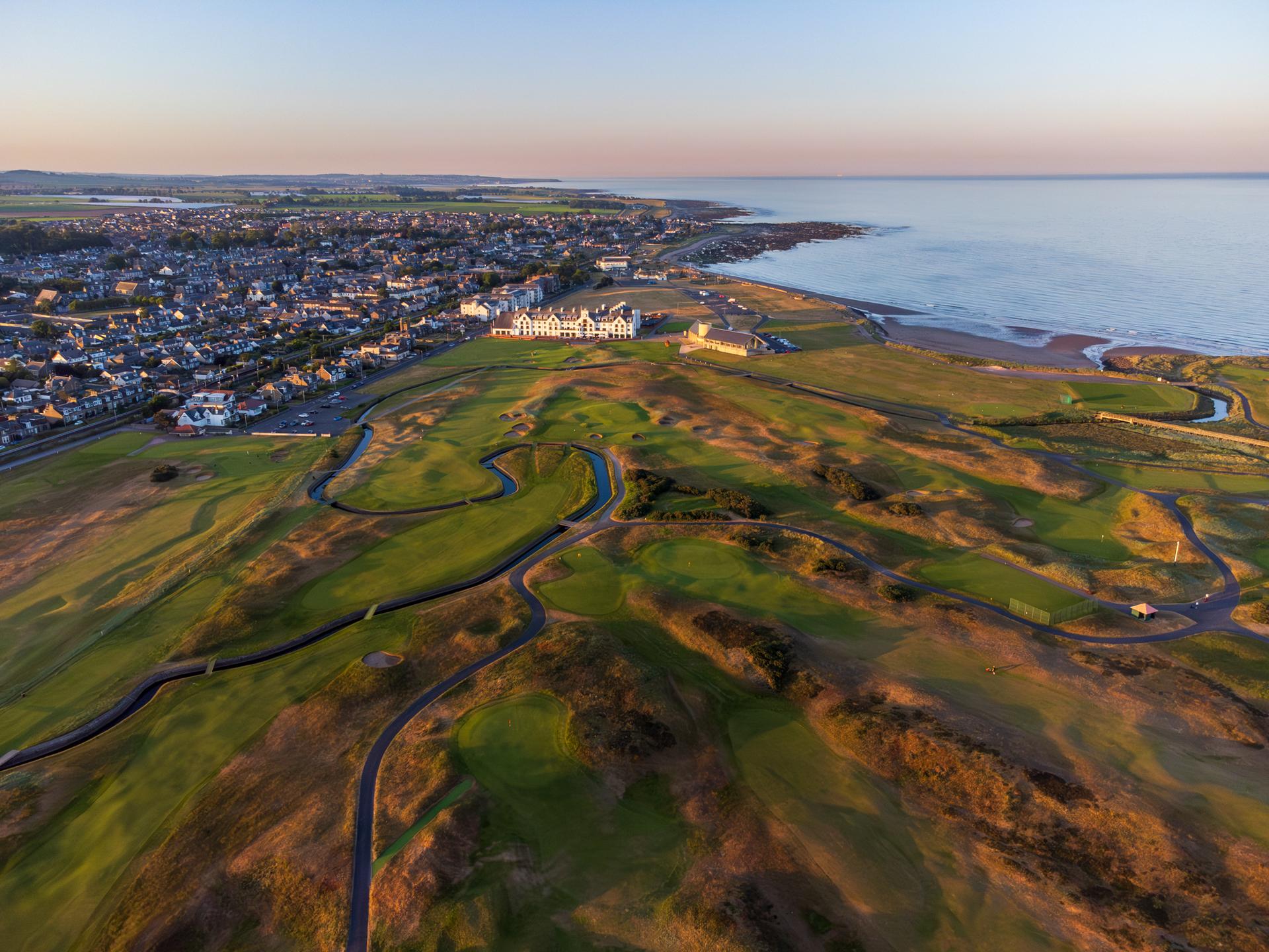 Aerial view of the Cornoustie Golf Links course with coastal views