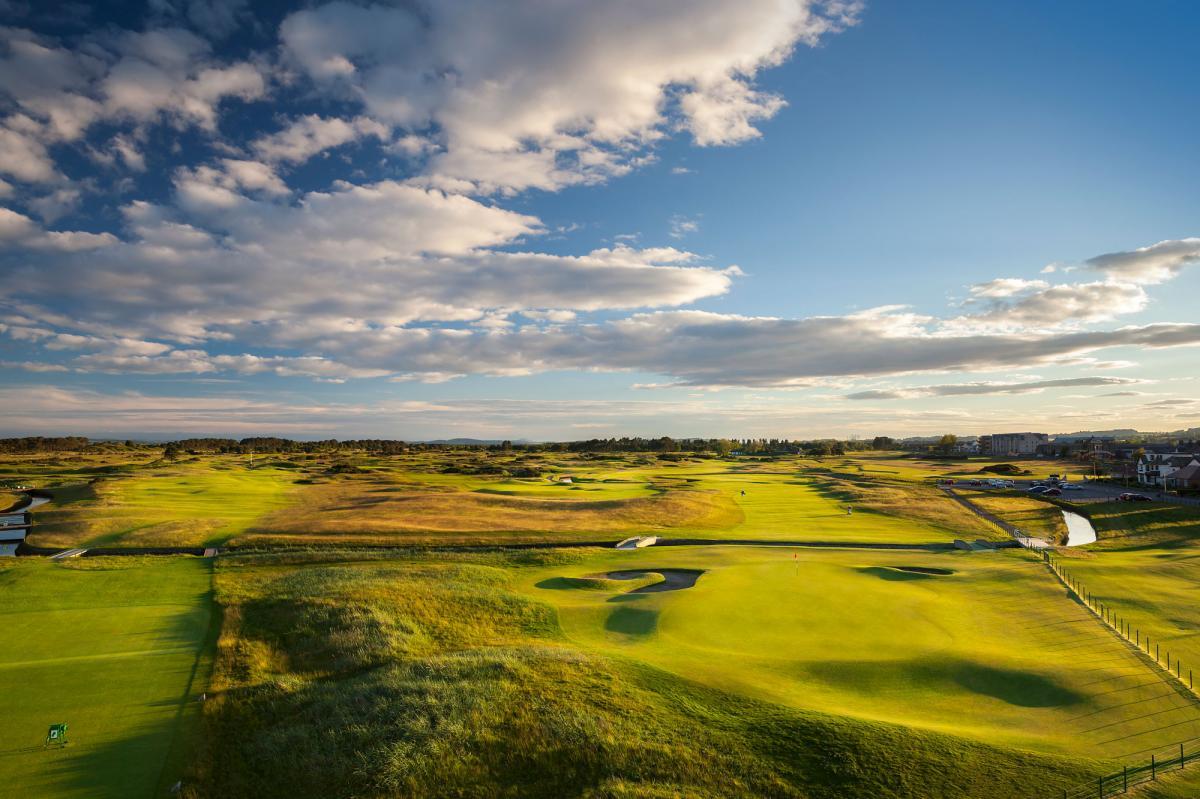 Overhead view of the smooth greens and wide fairways featuring a river running through the course