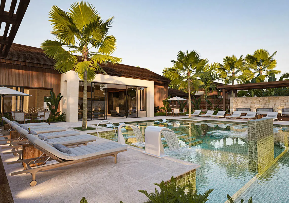 Another swimming pool at the resort with water fountains and a spa room