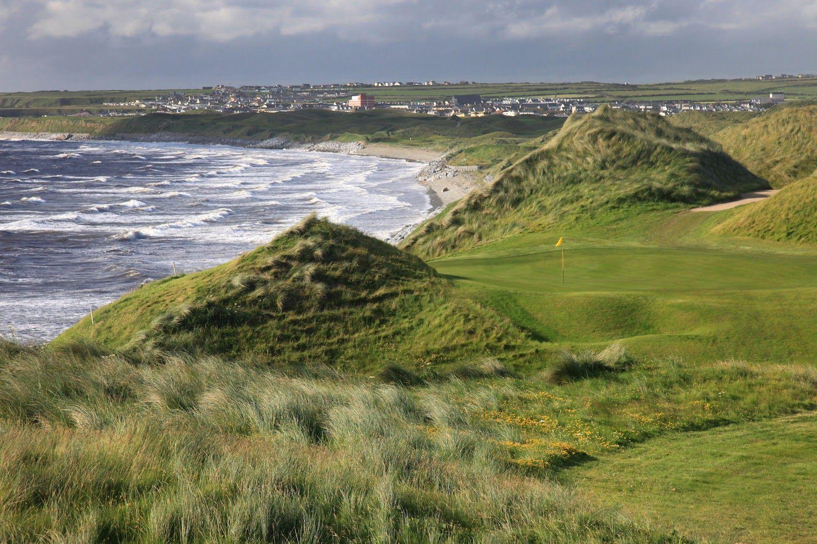 Hilly landscape with mature grass just next to the manicured greens