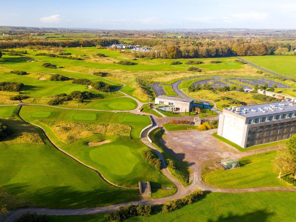 Bird’s-eye view of the Castlemartyr Resort hotel surrounded by manicured fairways and practice areas.