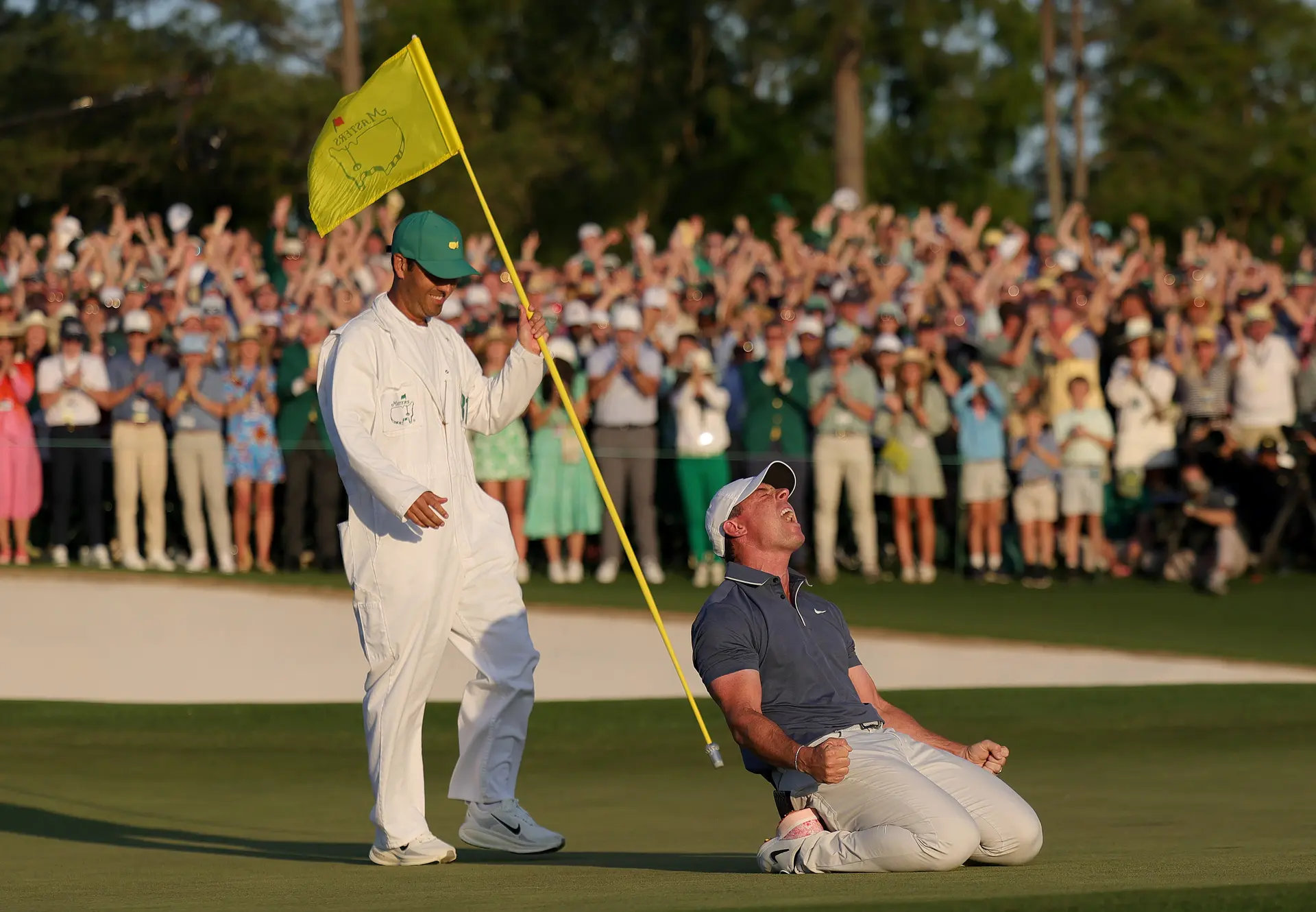 Golfer celebrating a win at the Championship Sunday at The Masters