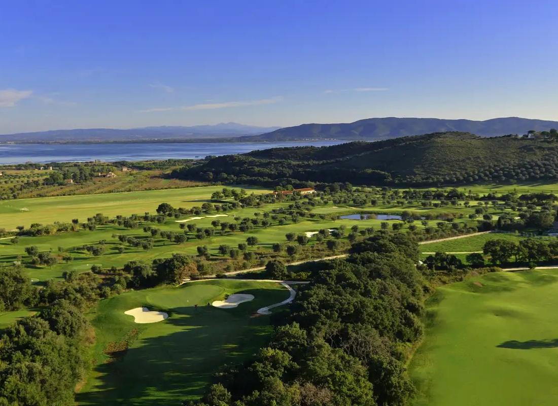 Overhead shot of the golf course with sea views in the distance
