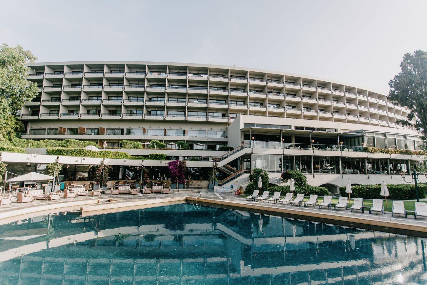 Panoramic view of the Corfu Holiday Palace building overlooking their swimming pool