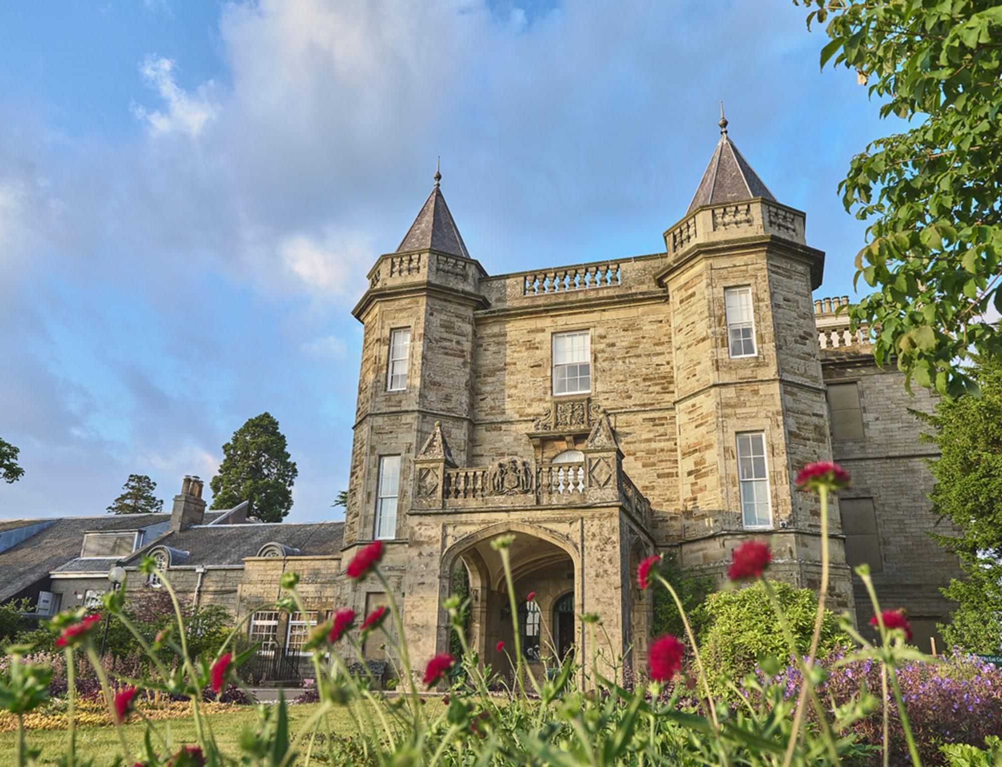 From the flowers looking up at the castle like resort building