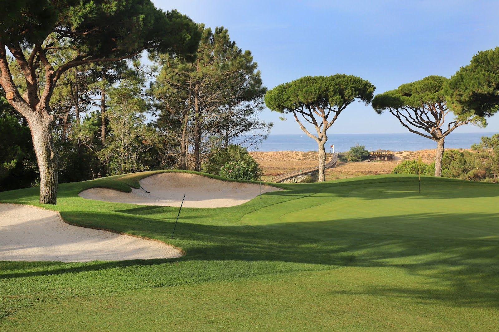 Undularing greens with deep bunkers behind