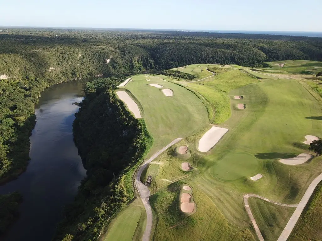 Aerial view of the Dye Fore course nestled with sand bunkers next to a water filled trench