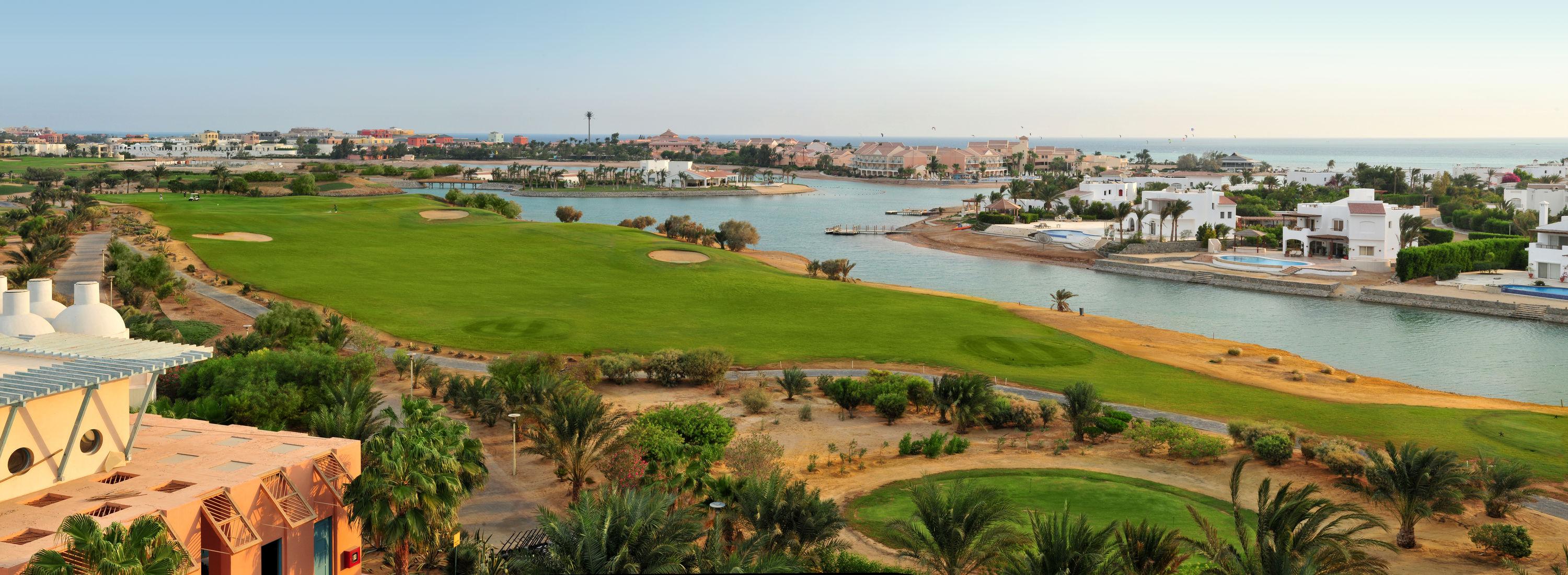 A panoramic view of the golf course and lagoon-side villas near the Red Sea.