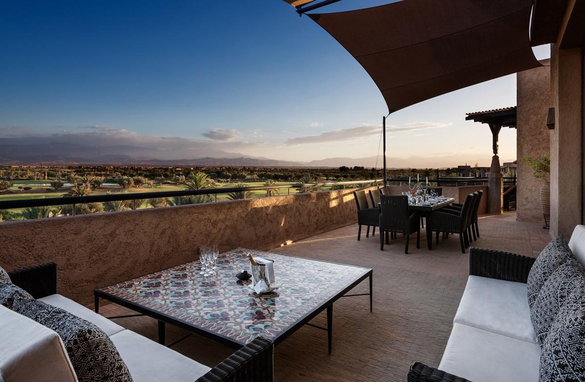 Outdoor balcony dining and lounging area at the Fairmont Royal Palm Marrakech