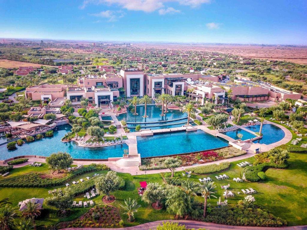 Aerial view of the Fairmont Royal Palm Marrakech showing their buildings and swimming pools