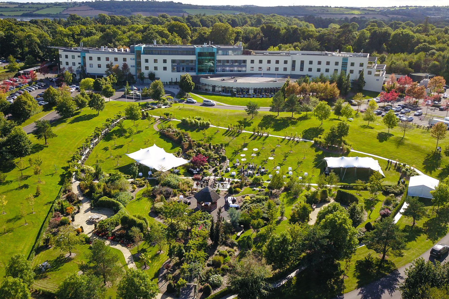 Garden event space with tents and winding pathways
