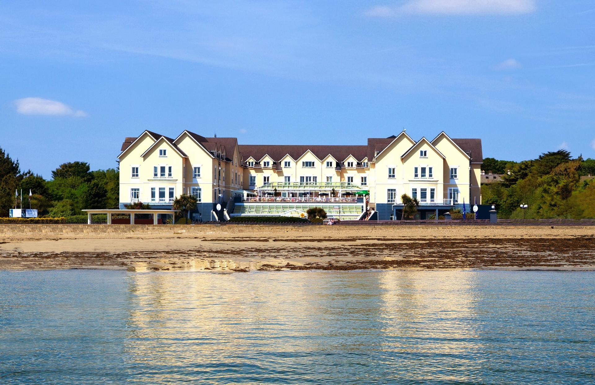 Modern clubhouse at the Galway Bay Golf Club overlooking the beach