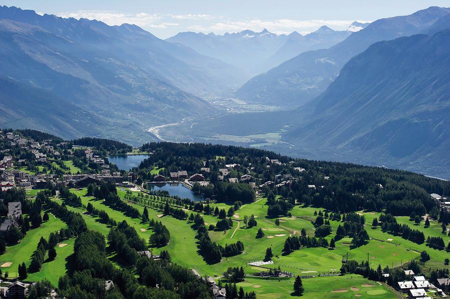 Overhead view of the Golf Club de Crans Sur Sierre nestled between mountains