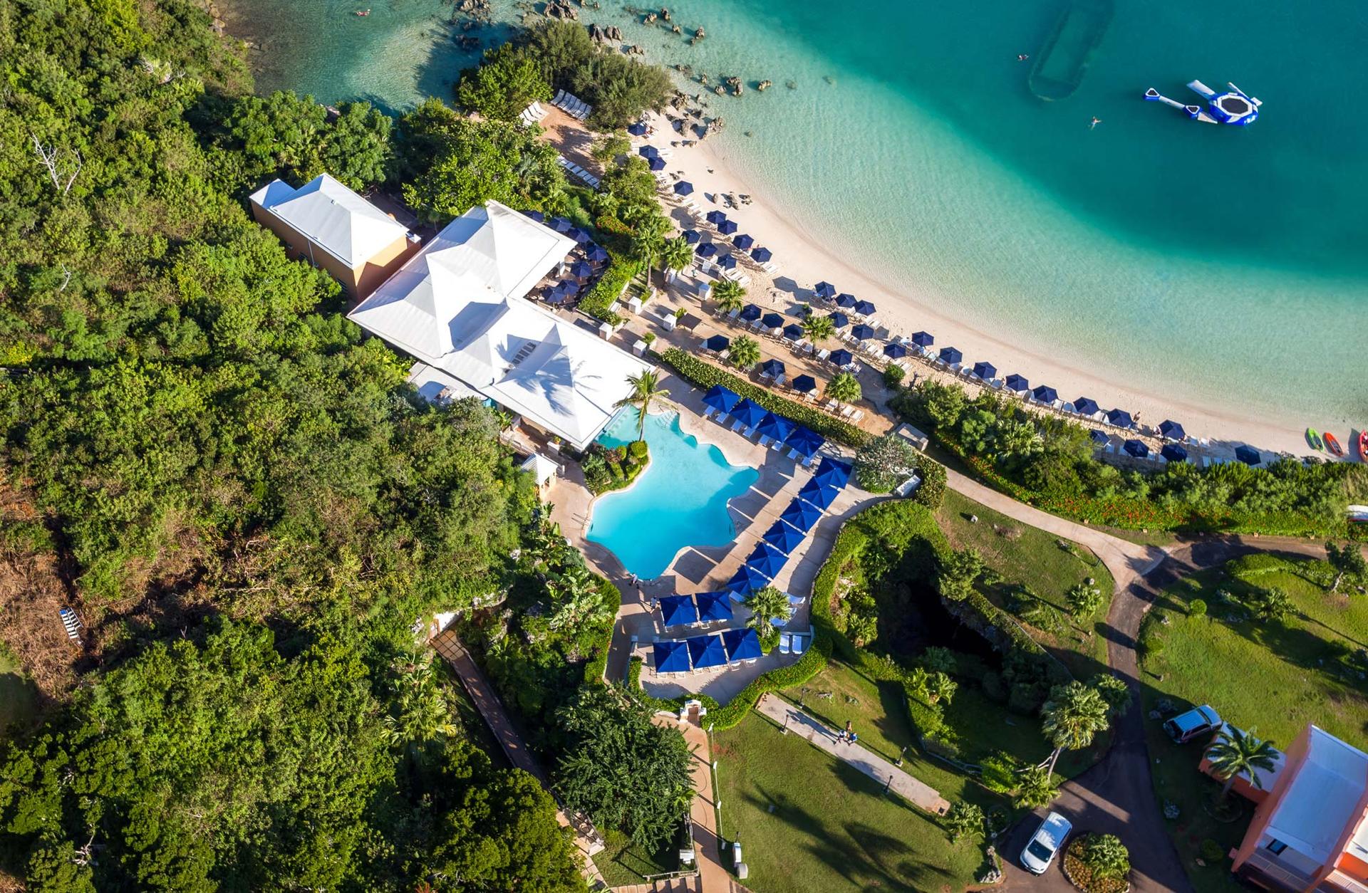 Overhead view of the swimming pool leading onto the beach featuring a water game